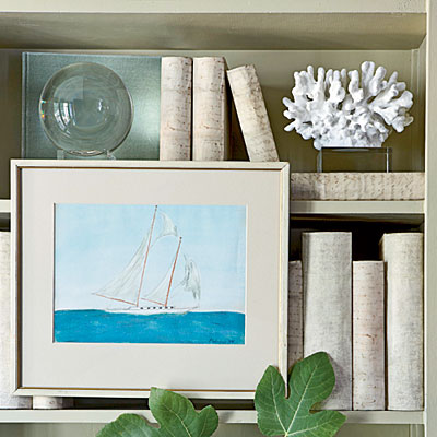 image of bookshelf with framed art