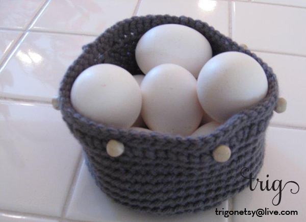 blue-gray basket, wood bead accents, filled with eggs